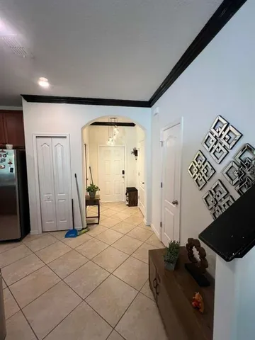 a bedroom with a bed and a mirror