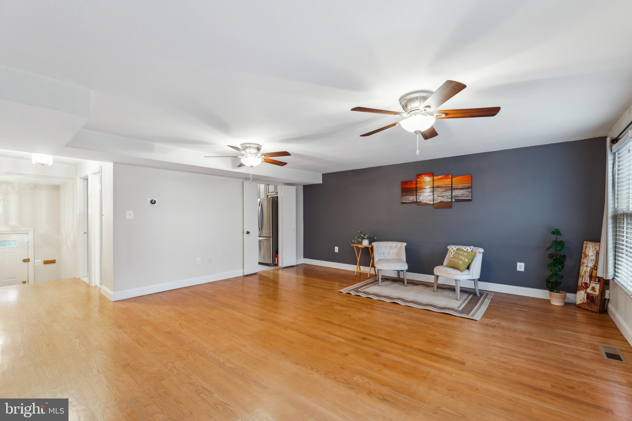 8112 Rhodell Lane Springfield, VA 22153 - Photo 6 of 15 a living room with furniture and a flat screen tv