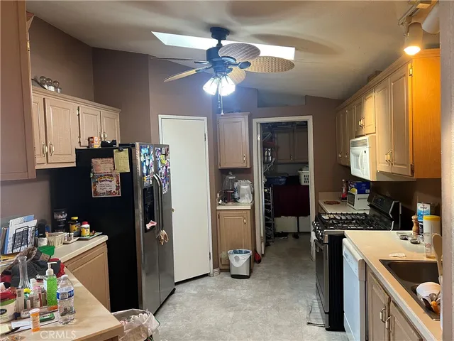 a kitchen with refrigerator and window