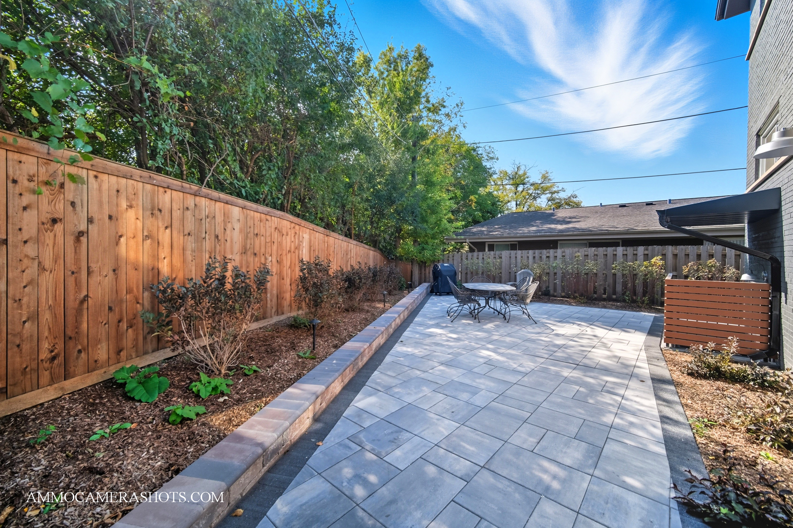 143 Ann Street, Unit 1S Clarendon Hills, IL 60514 - Photo 18 of 27 a view of a patio with table and chairs with wooden floor and plants