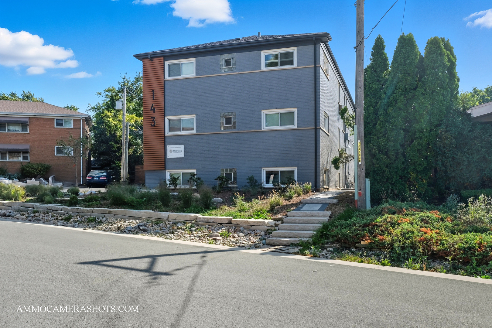 143 Ann Street, Unit 1S Clarendon Hills, IL 60514 - Photo 22 of 27 a front view of a house with garden and street view