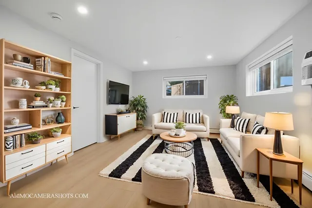 a bedroom with furniture and a flat screen tv