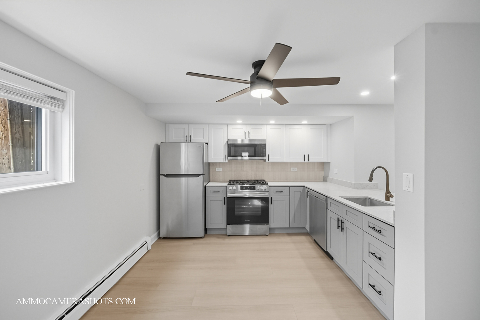 143 Ann Street, Unit 1S Clarendon Hills, IL 60514 - Photo 9 of 27 a large kitchen with stainless steel appliances granite countertop a stove and a sink