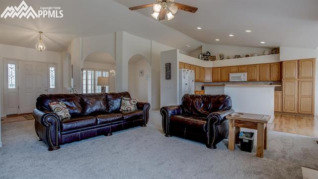 9232 Rockingham Drive Peyton, CO 80831 - Photo 7 of 35 Living room looking into the kitchen.