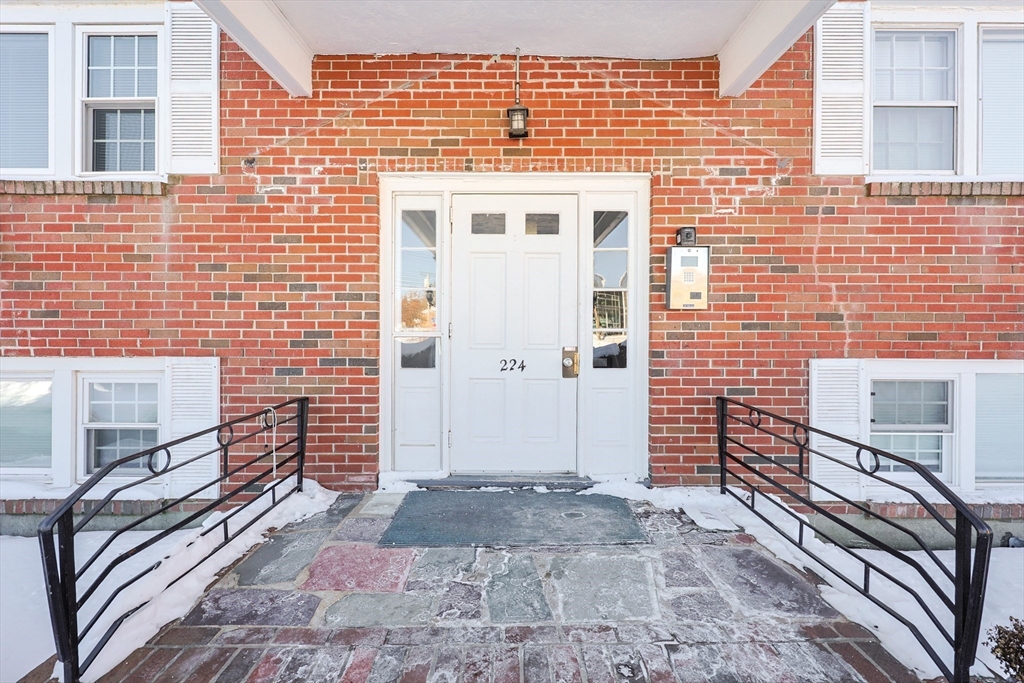 224 School Street, Unit 9 Walpole, MA 02081 - Photo 2 of 31 a front view of a building with a couple of windows