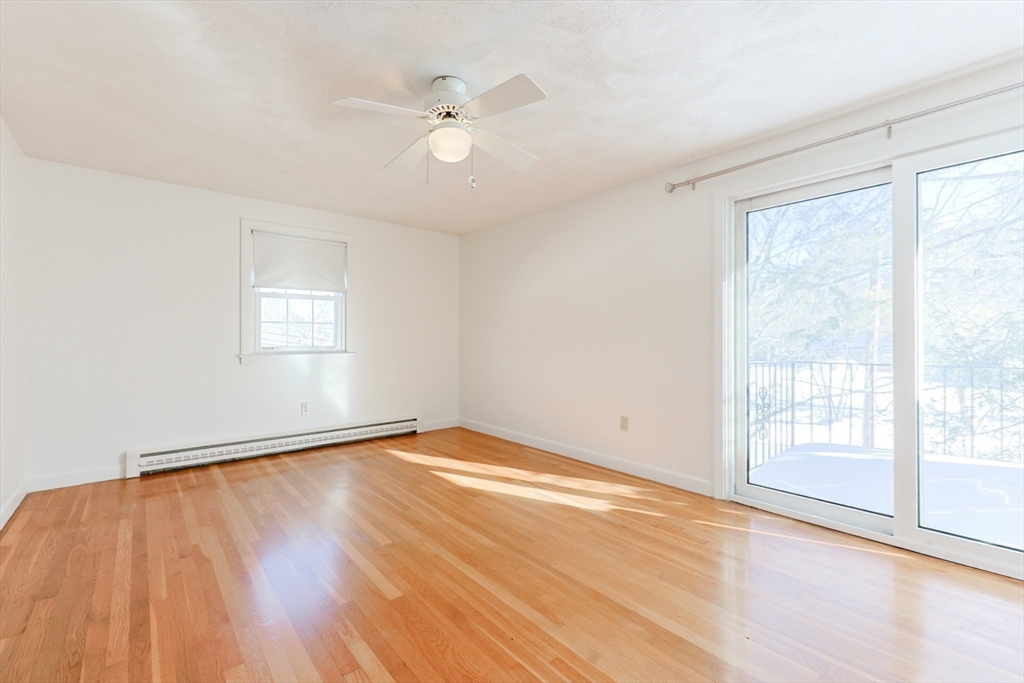 224 School Street, Unit 9 Walpole, MA 02081 - Photo 21 of 31 wooden floor in an empty room with a window