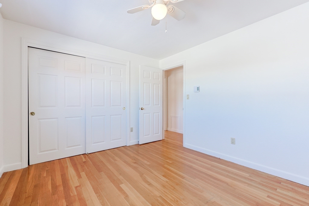 224 School Street, Unit 9 Walpole, MA 02081 - Photo 23 of 31 a view of empty room with wooden floor