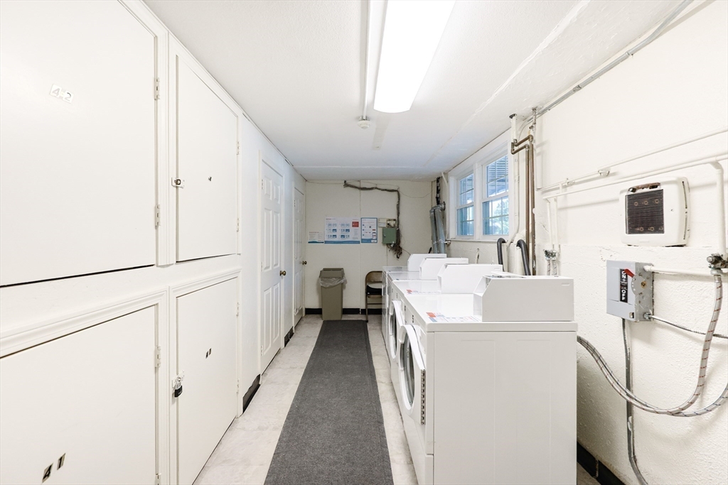 224 School Street, Unit 9 Walpole, MA 02081 - Photo 29 of 31 a view of a kitchen with furniture and washer