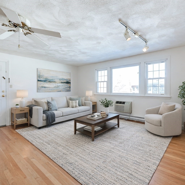 224 School Street, Unit 9 Walpole, MA 02081 - Photo 7 of 31 a living room with furniture and a couch