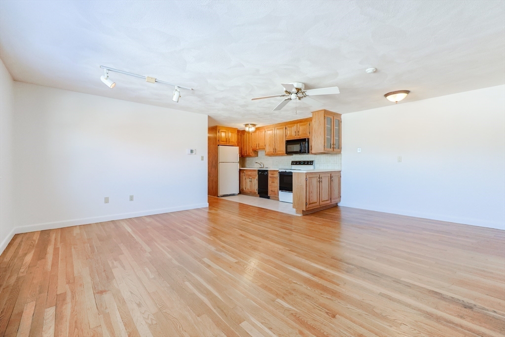 224 School Street, Unit 9 Walpole, MA 02081 - Photo 10 of 31 a view of a kitchen with a sink and cabinet