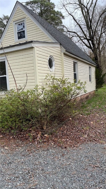 715 Rappahannock Drive White Stone, VA 22578 - Photo 12 of 12 a backyard of a house with plants and tree
