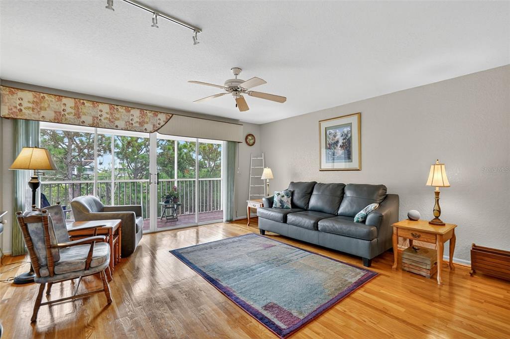 14879 Seminole Trail Seminole, FL 33776 - Photo 12 of 40 a living room with furniture a lamp and a table