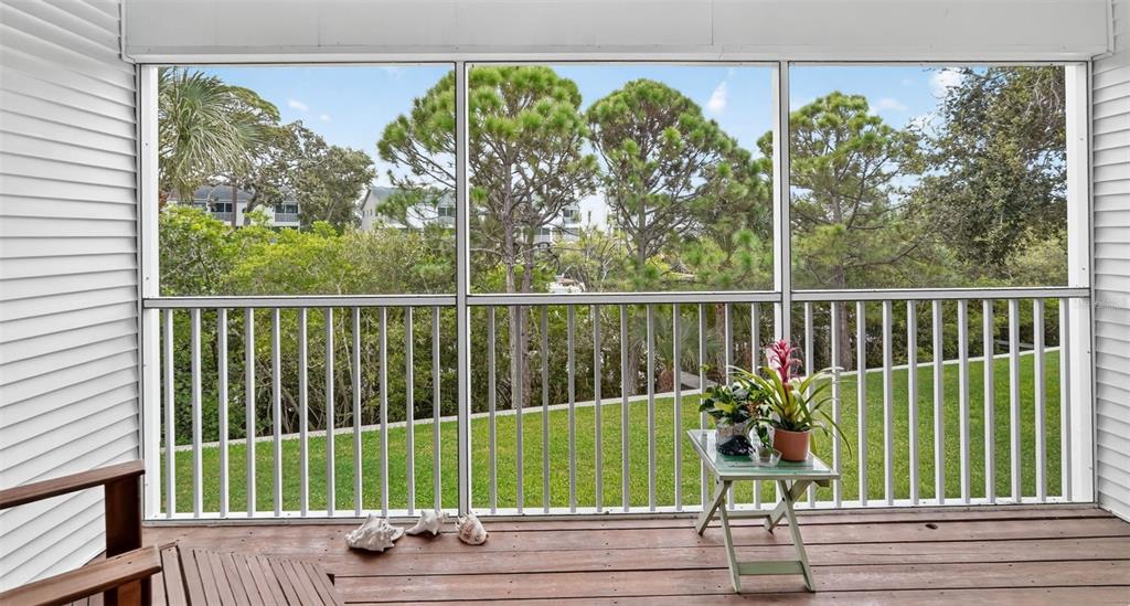 14879 Seminole Trail Seminole, FL 33776 - Photo 13 of 40 a view of a wooden deck and a yard