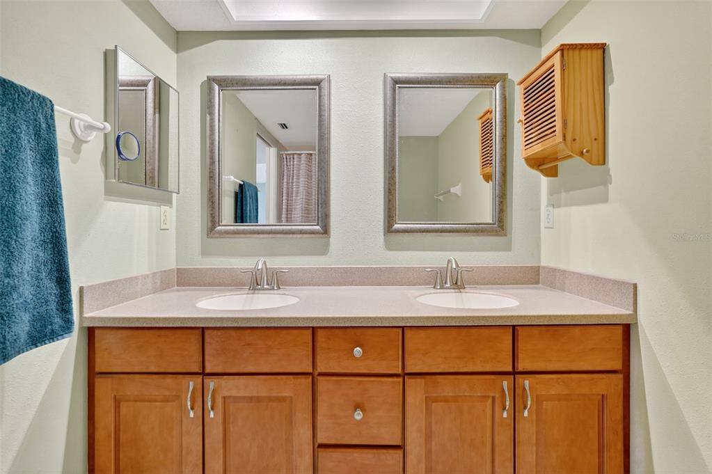 14879 Seminole Trail Seminole, FL 33776 - Photo 21 of 40 a bathroom with a sink and a mirror