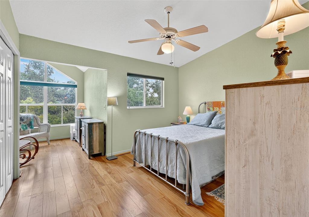 14879 Seminole Trail Seminole, FL 33776 - Photo 25 of 40 a bedroom with a bed and a view of balcony