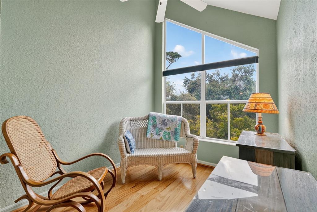 14879 Seminole Trail Seminole, FL 33776 - Photo 29 of 40 a living room with furniture and a floor to ceiling window