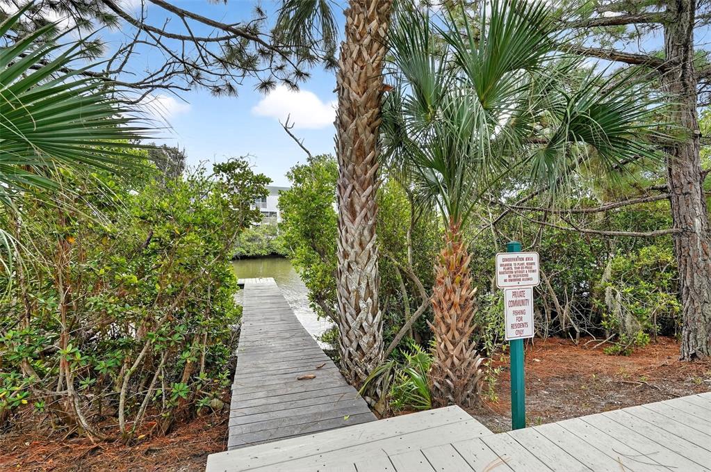 14879 Seminole Trail Seminole, FL 33776 - Photo 35 of 40 a pathway of a house with a yard