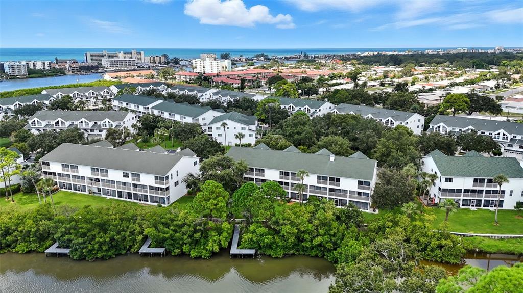 14879 Seminole Trail Seminole, FL 33776 - Photo 36 of 40 an aerial view of a house with a garden and lake view