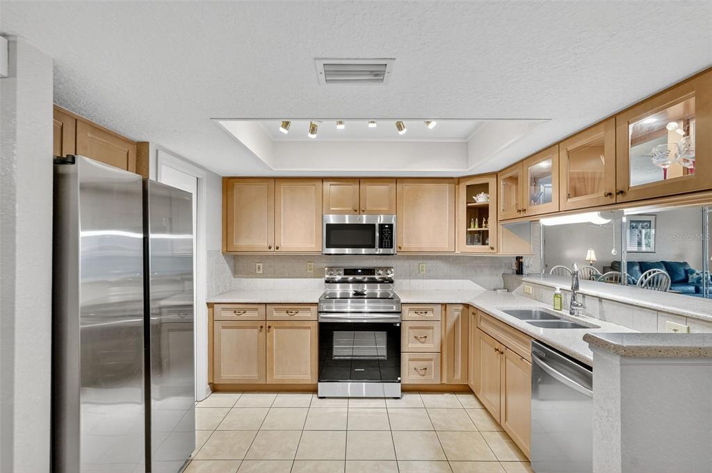 14879 Seminole Trail Seminole, FL 33776 - Photo 4 of 40 a kitchen with a sink stove and refrigerator