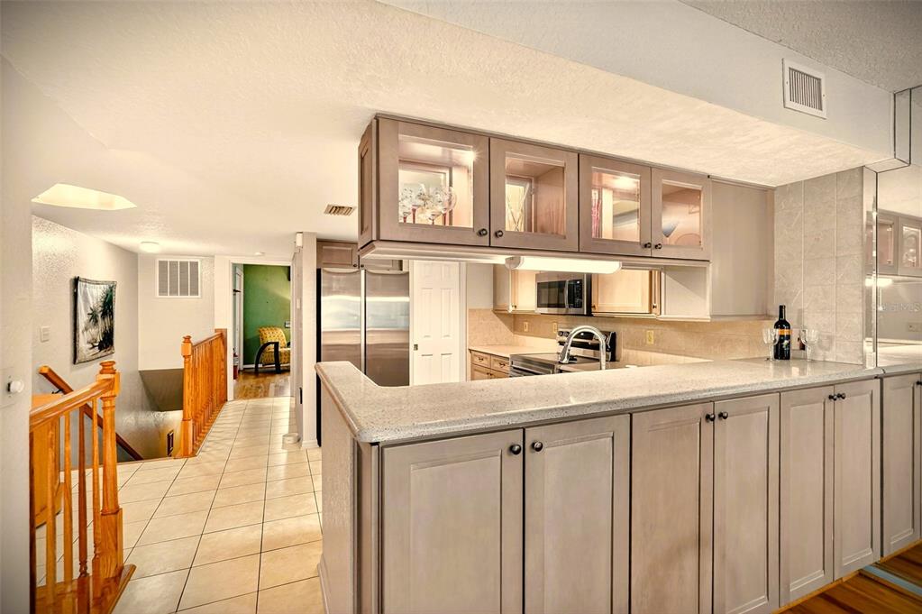 14879 Seminole Trail Seminole, FL 33776 - Photo 8 of 40 a kitchen with counter top space and windows