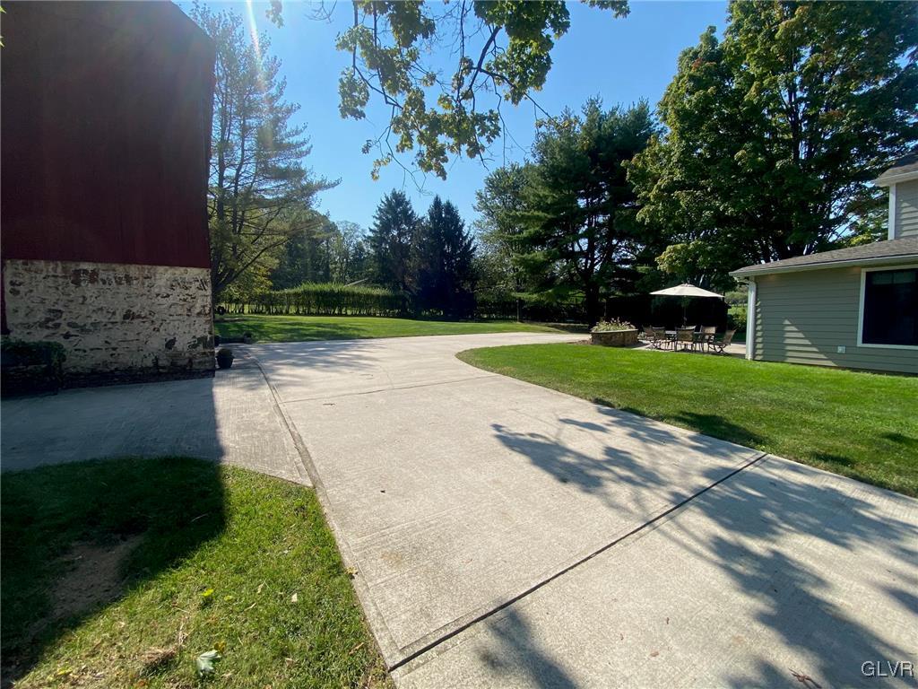 1665 Easton Road Hellertown, PA 18055 - Photo 28 of 37 a view of a backyard with large trees
