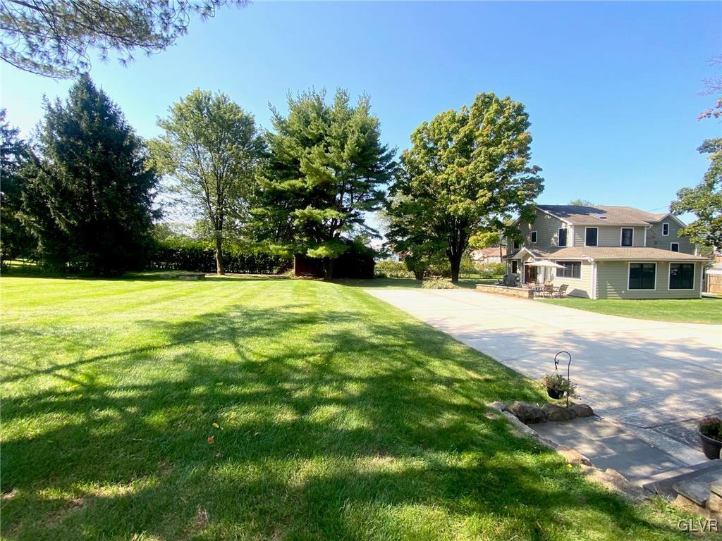1665 Easton Road Hellertown, PA 18055 - Photo 29 of 37 a swimming pool with trees in the background