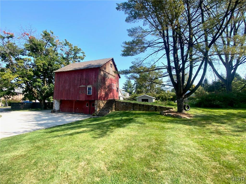 1665 Easton Road Hellertown, PA 18055 - Photo 30 of 37 a view of a backyard with large trees