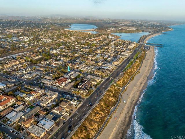 an aerial view of beach and ocean
