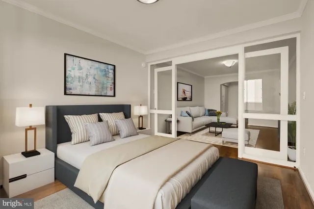 a bed room with a bed and a large mirror