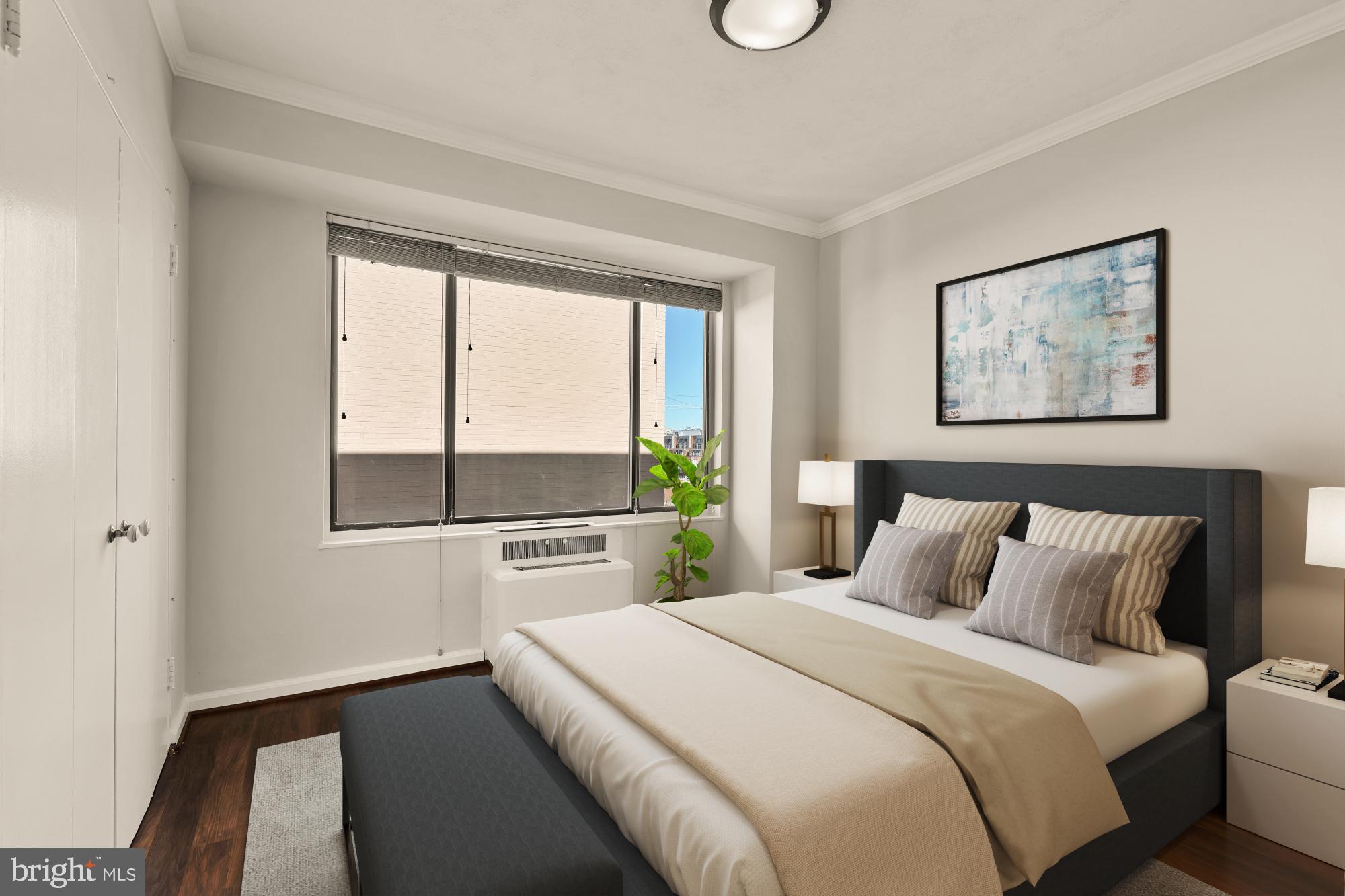 1 Scott Circle Northwest, Unit 719 Washington, DC 20036 - Photo 14 of 20 a bedroom with a bed and a large window