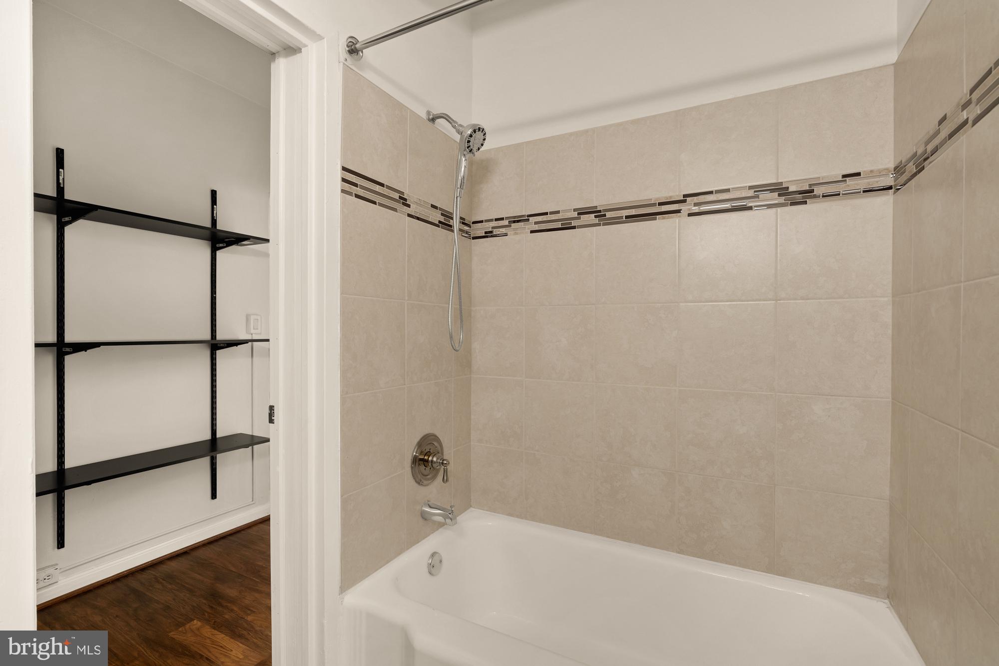 1 Scott Circle Northwest, Unit 719 Washington, DC 20036 - Photo 18 of 20 a bathroom with a bathtub and a shower