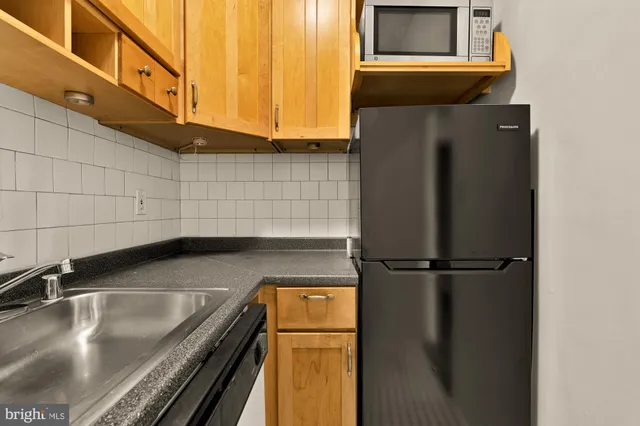 a close view of sink and washing machine