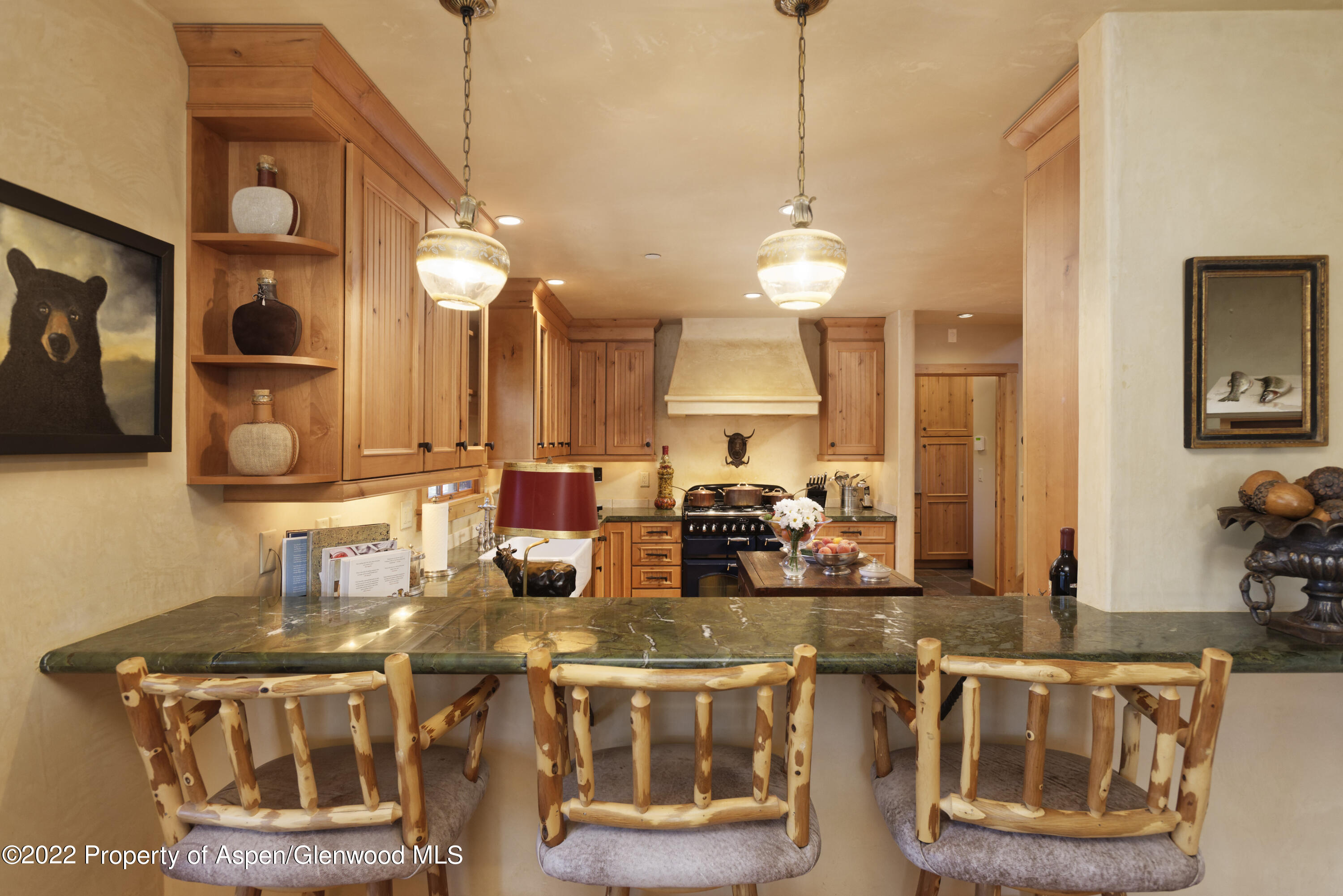 301 Stone Road Basalt, CO 81621 - Photo 12 of 45 a kitchen with a stove a sink and a wooden cabinets