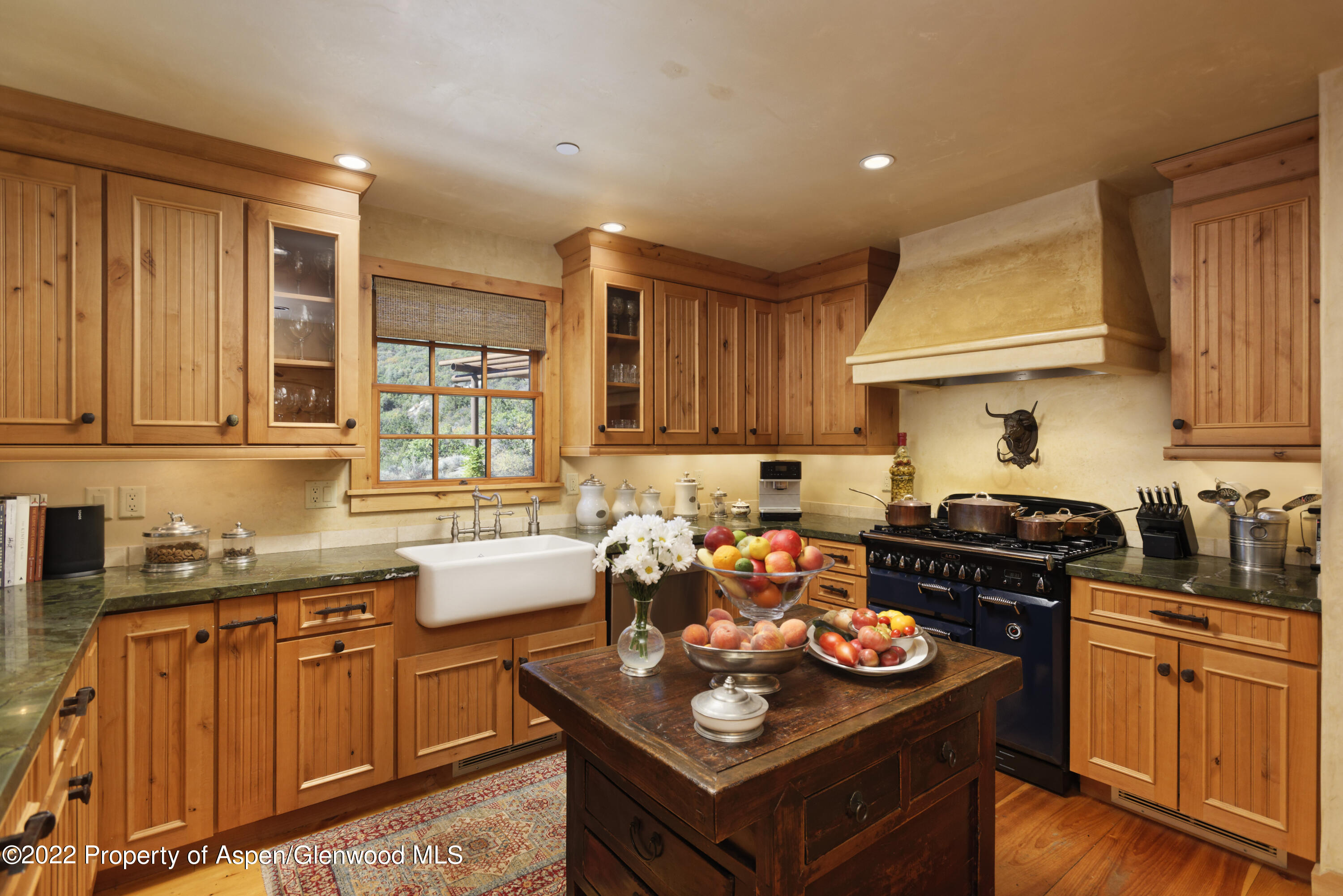 301 Stone Road Basalt, CO 81621 - Photo 13 of 45 a kitchen with stainless steel appliances granite countertop a stove top oven a sink dishwasher and cabinets with wooden floor