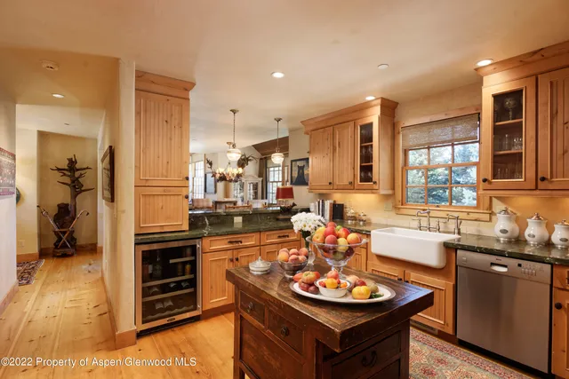 a kitchen with a stove a sink and a refrigerator