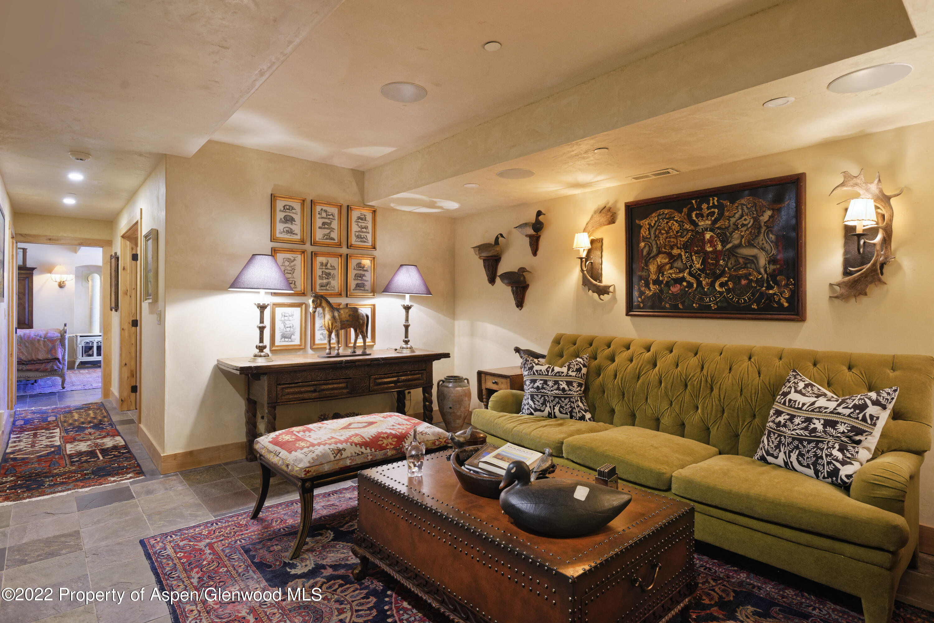 301 Stone Road Basalt, CO 81621 - Photo 17 of 45 a living room with furniture a rug and a wall painting