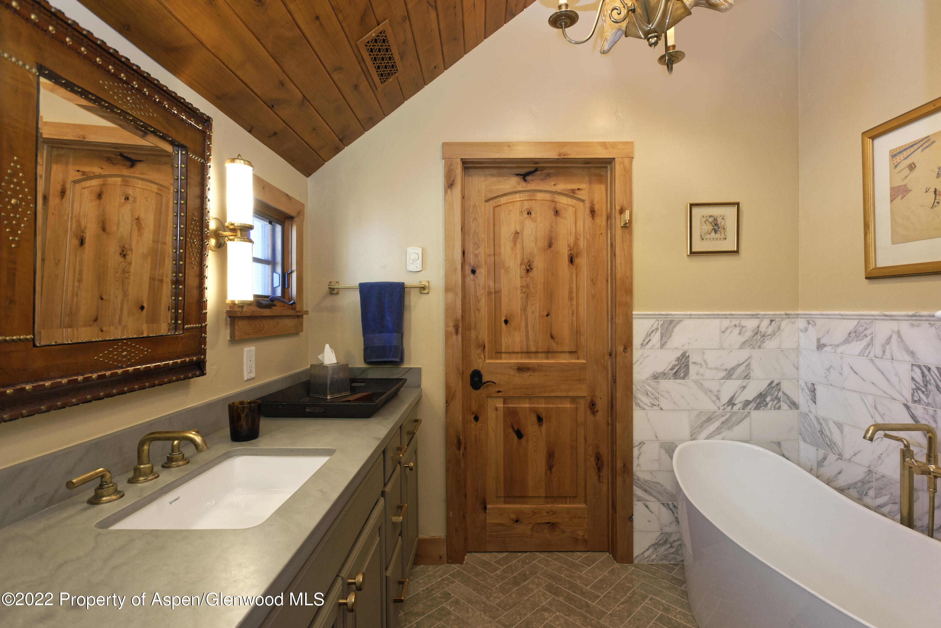 301 Stone Road Basalt, CO 81621 - Photo 20 of 45 a bathroom with a tub sink and mirror