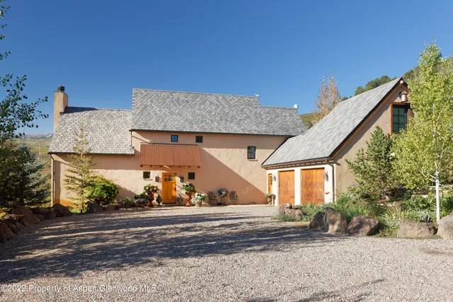 a view of a house with a street