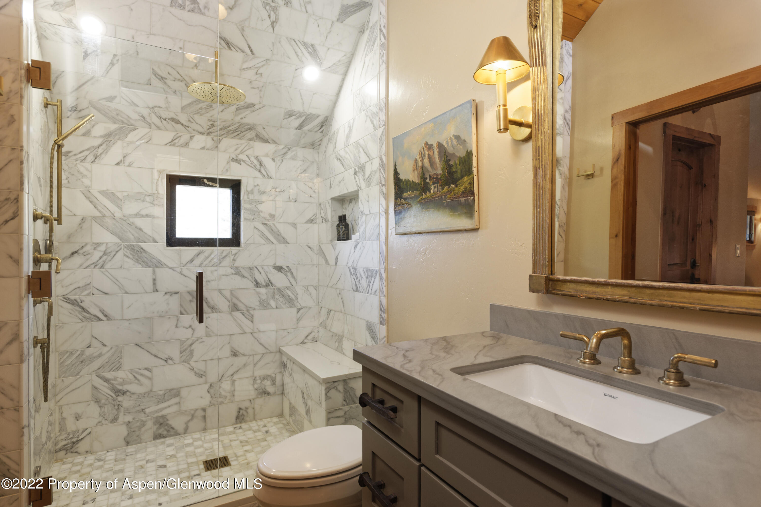 301 Stone Road Basalt, CO 81621 - Photo 21 of 45 a bathroom with a granite countertop toilet sink and mirror