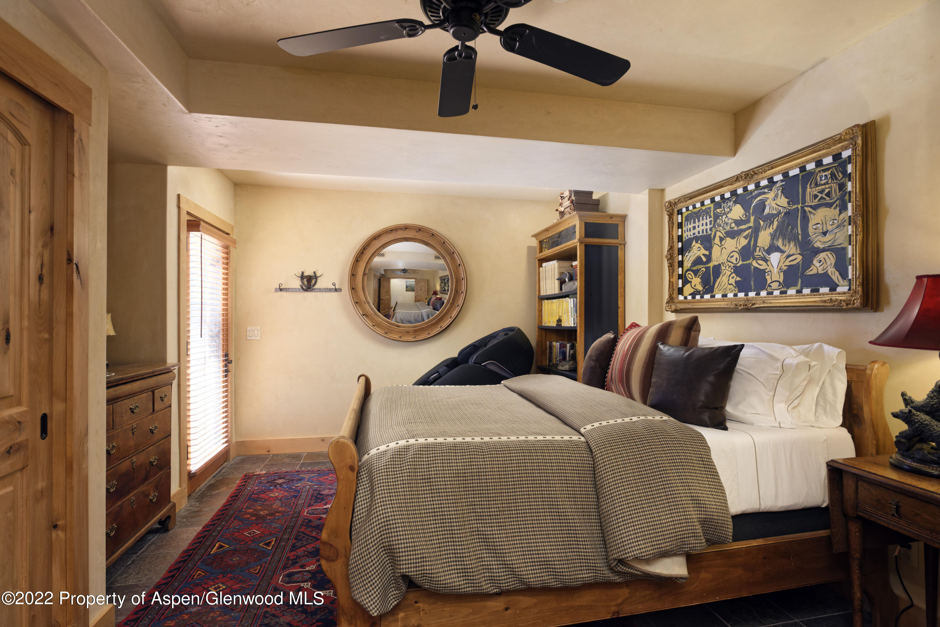 301 Stone Road Basalt, CO 81621 - Photo 22 of 45 a bedroom with a bed and painting on the wall