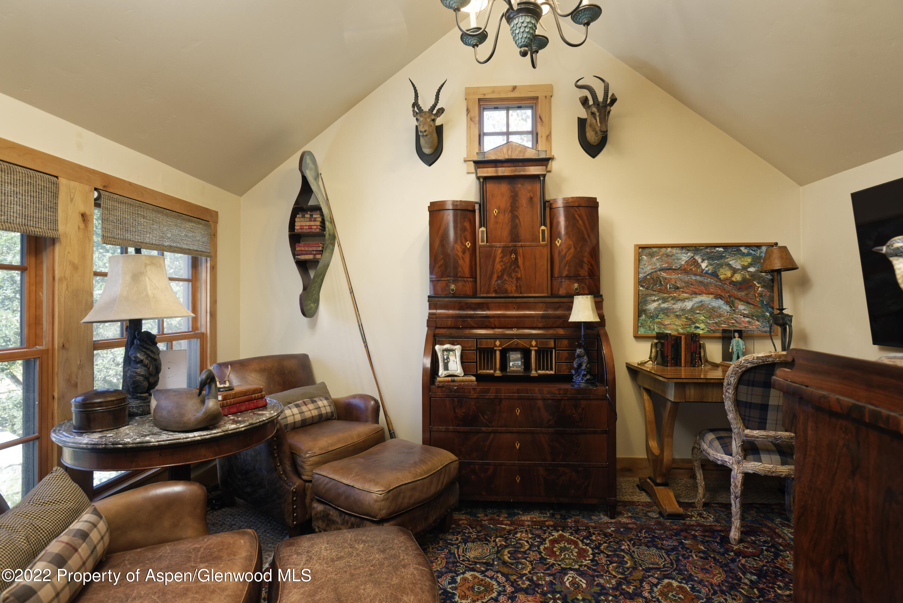 301 Stone Road Basalt, CO 81621 - Photo 26 of 45 a living room with furniture a chandelier and a flat screen tv