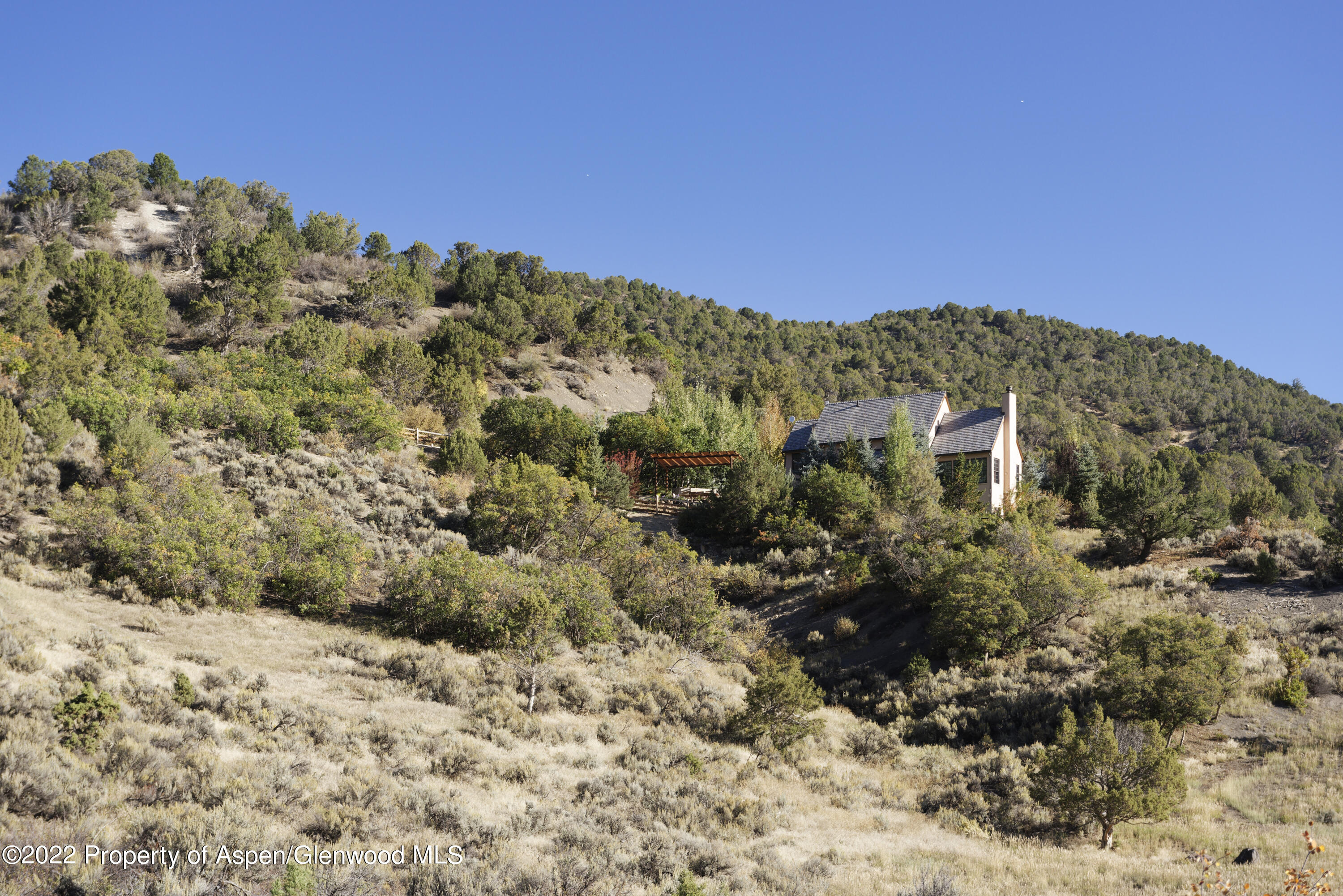 301 Stone Road Basalt, CO 81621 - Photo 28 of 45 a view of a large building with mountains in the background