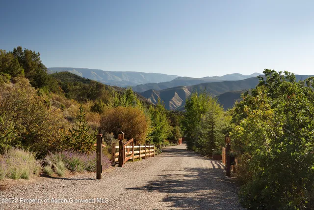 a view of a town with mountains in the background