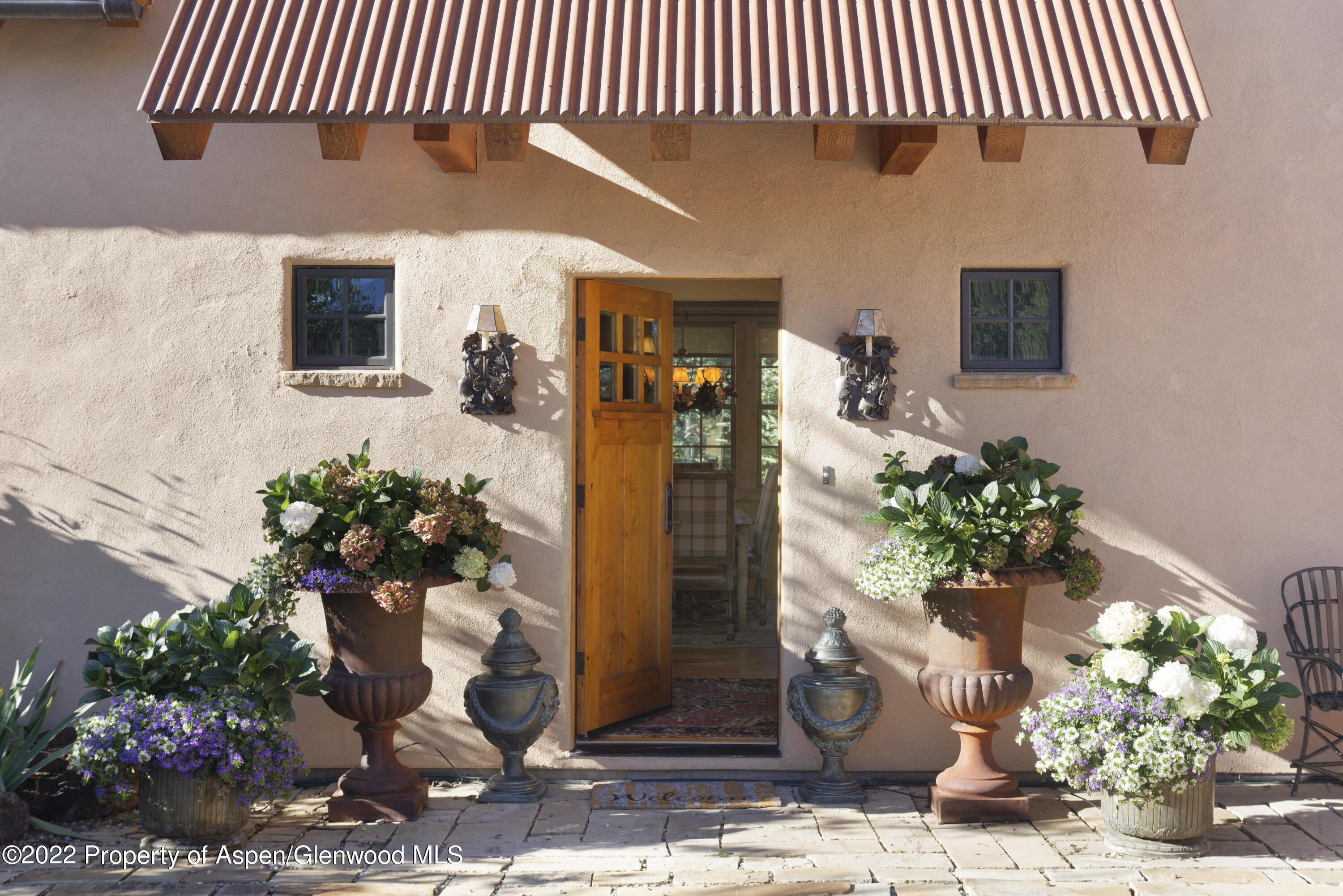 301 Stone Road Basalt, CO 81621 - Photo 3 of 45 a vase of flowers sitting on a floor