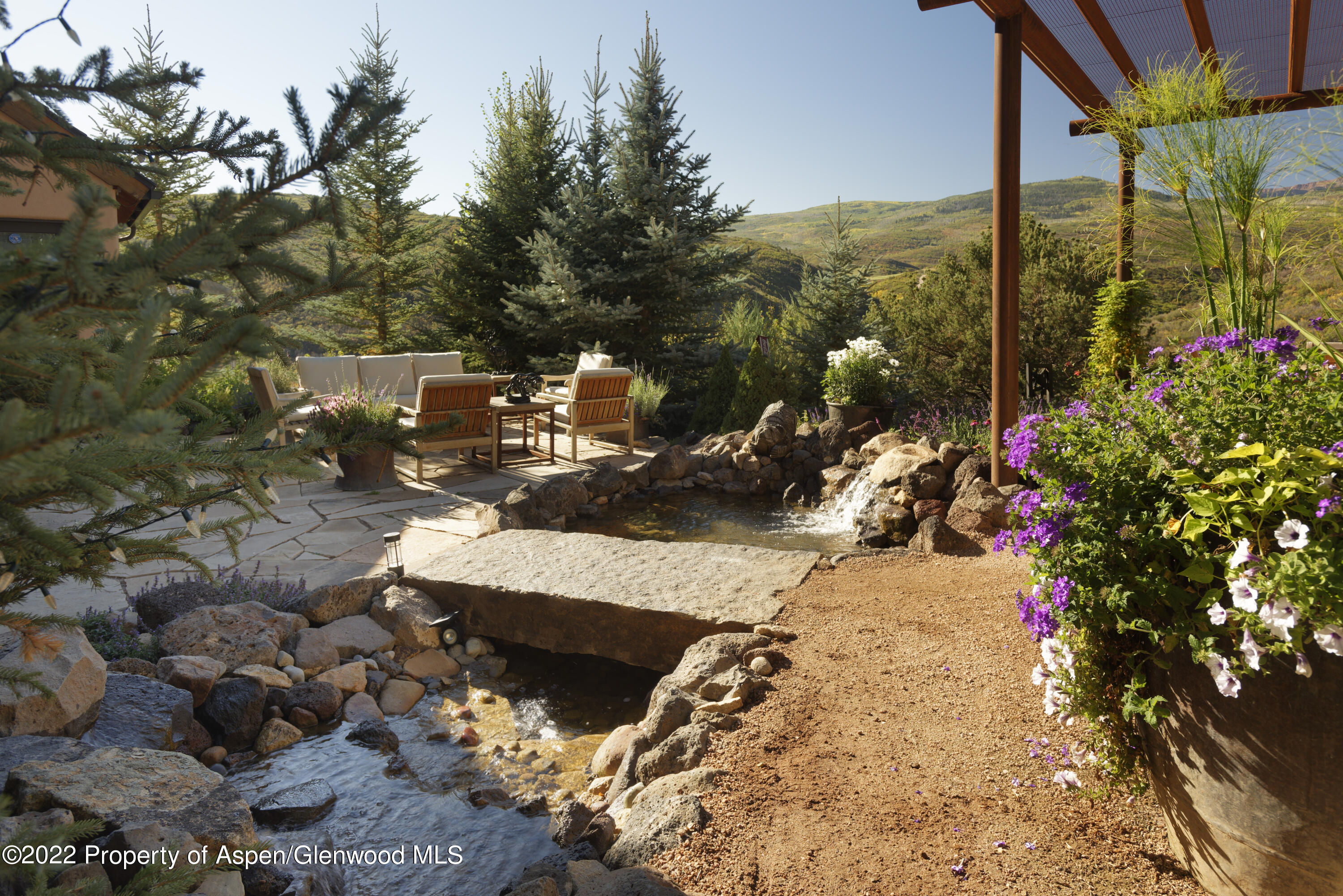 301 Stone Road Basalt, CO 81621 - Photo 31 of 45 a view of a patio with table and chairs and potted plants