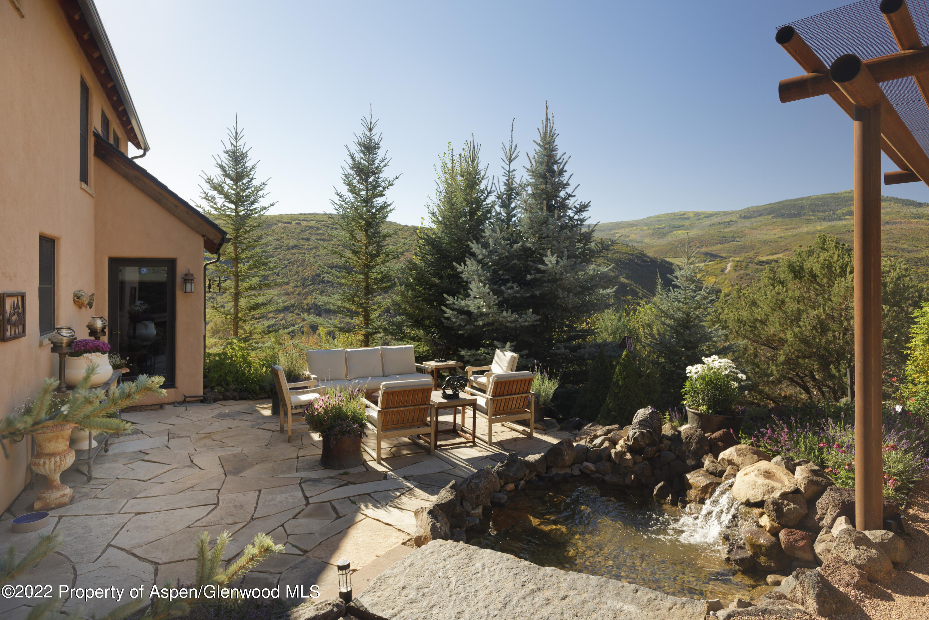 301 Stone Road Basalt, CO 81621 - Photo 32 of 45 a view of a patio with table and chairs with wooden floor and fence