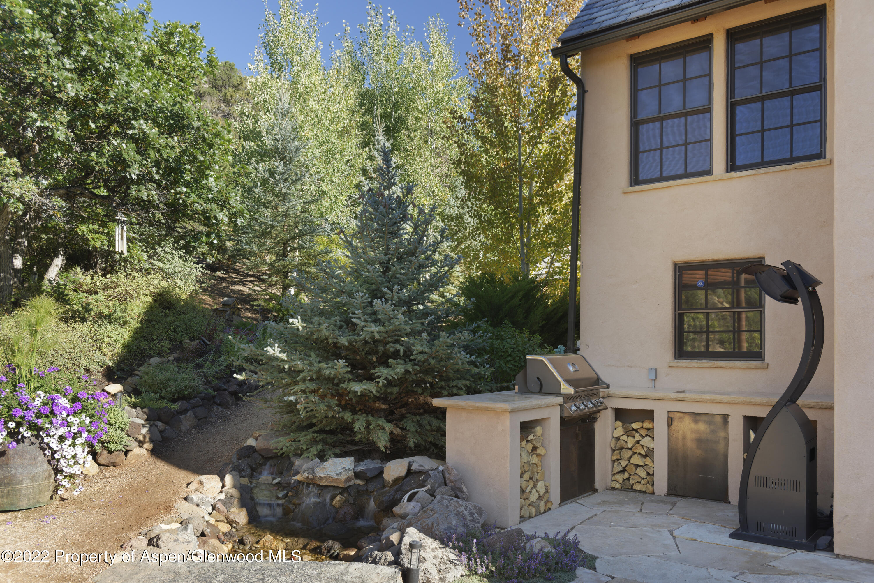 301 Stone Road Basalt, CO 81621 - Photo 36 of 45 a view of a patio with table and chairs and potted plants