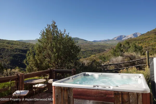 a view of a backyard with a sink and a table
