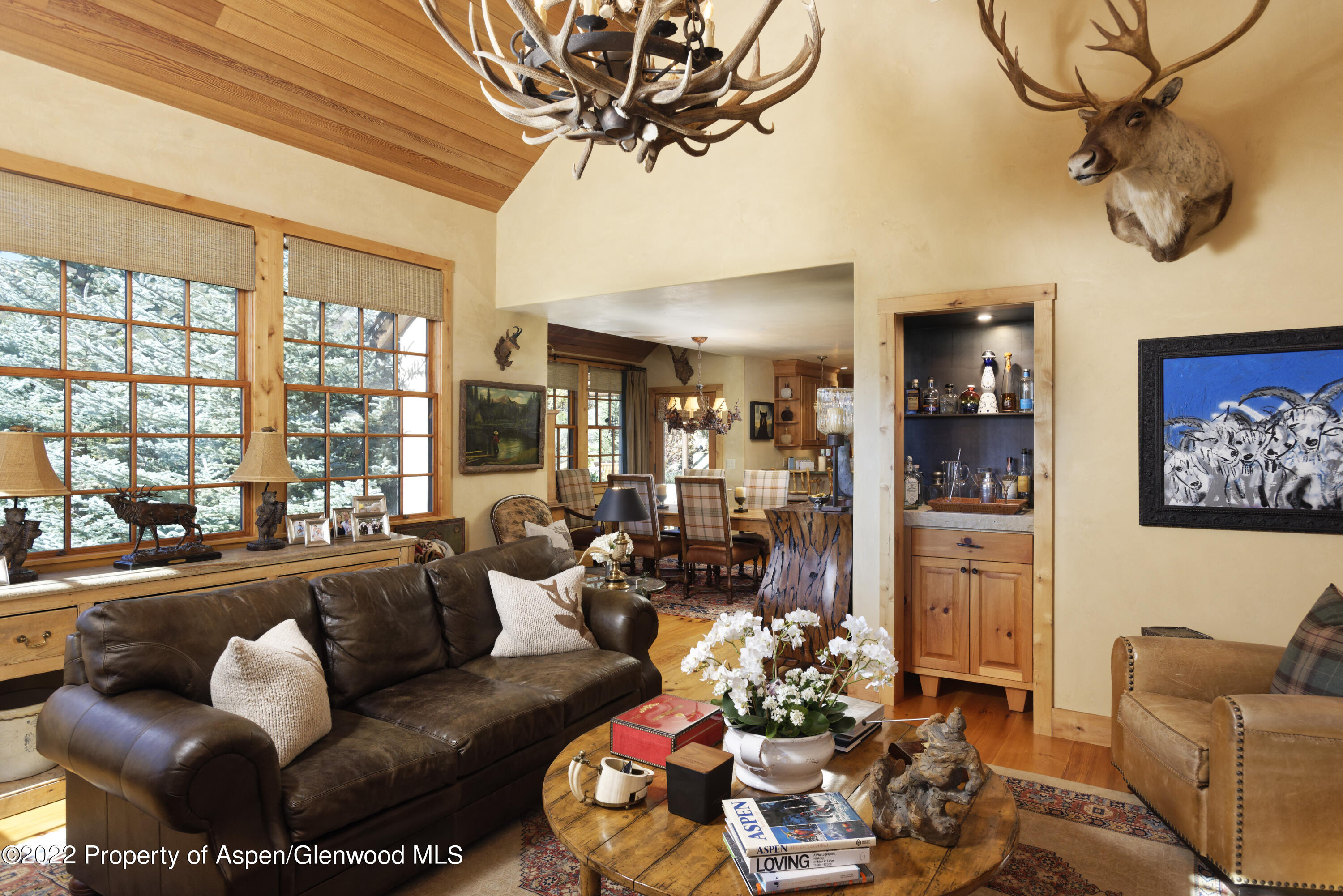 301 Stone Road Basalt, CO 81621 - Photo 8 of 45 a living room with furniture a chandelier and a floor to ceiling window