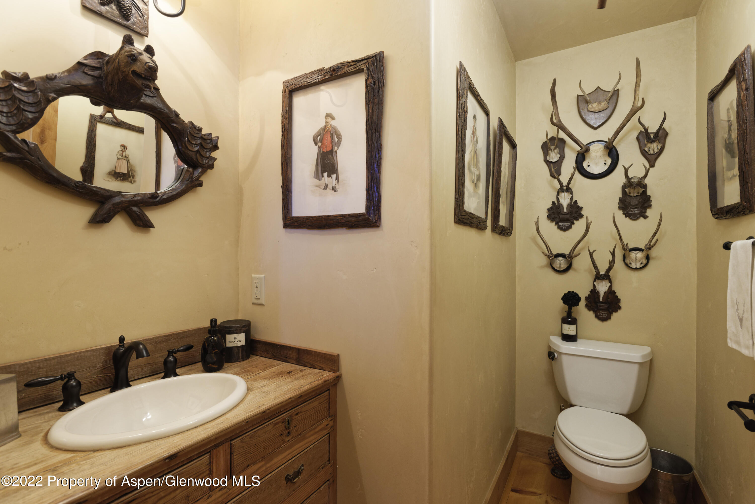 301 Stone Road Basalt, CO 81621 - Photo 9 of 45 a bathroom with a toilet sink and mirror